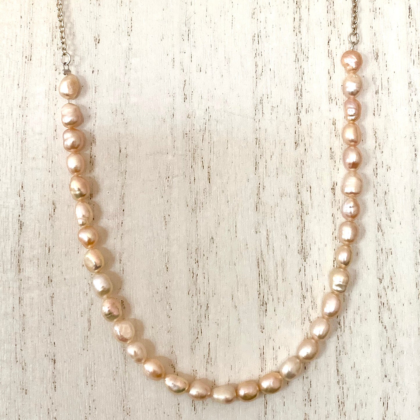 Pink Freshwater Pearl demi-strand,  attached to  from silver chain.