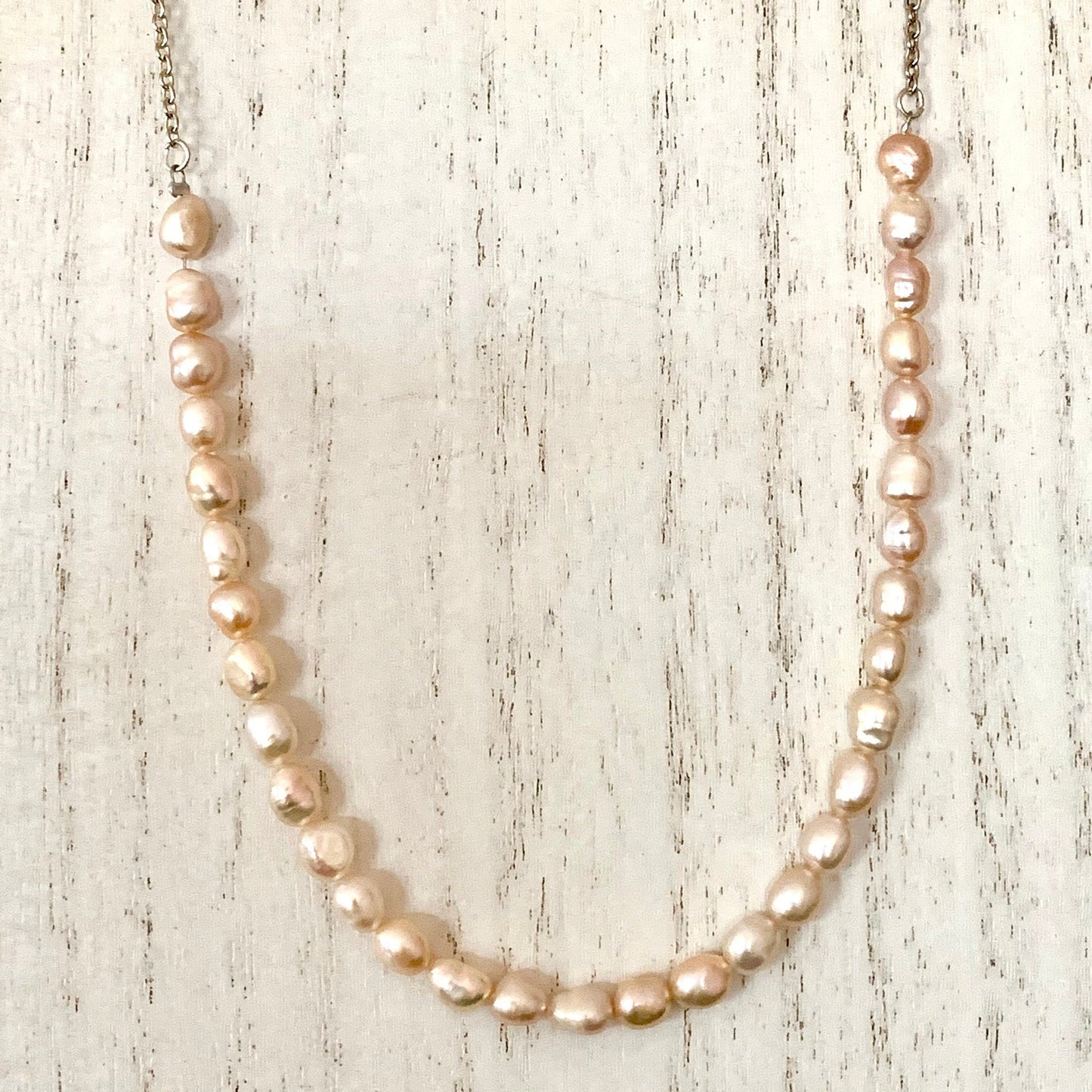 Pink Freshwater Pearl demi-strand,  attached to  from silver chain.
